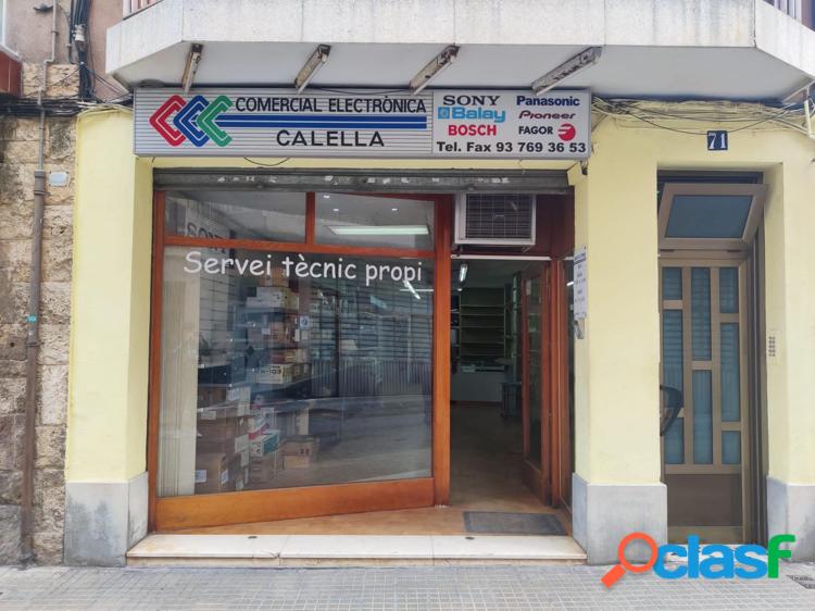 Local comercial grande con patio trasero